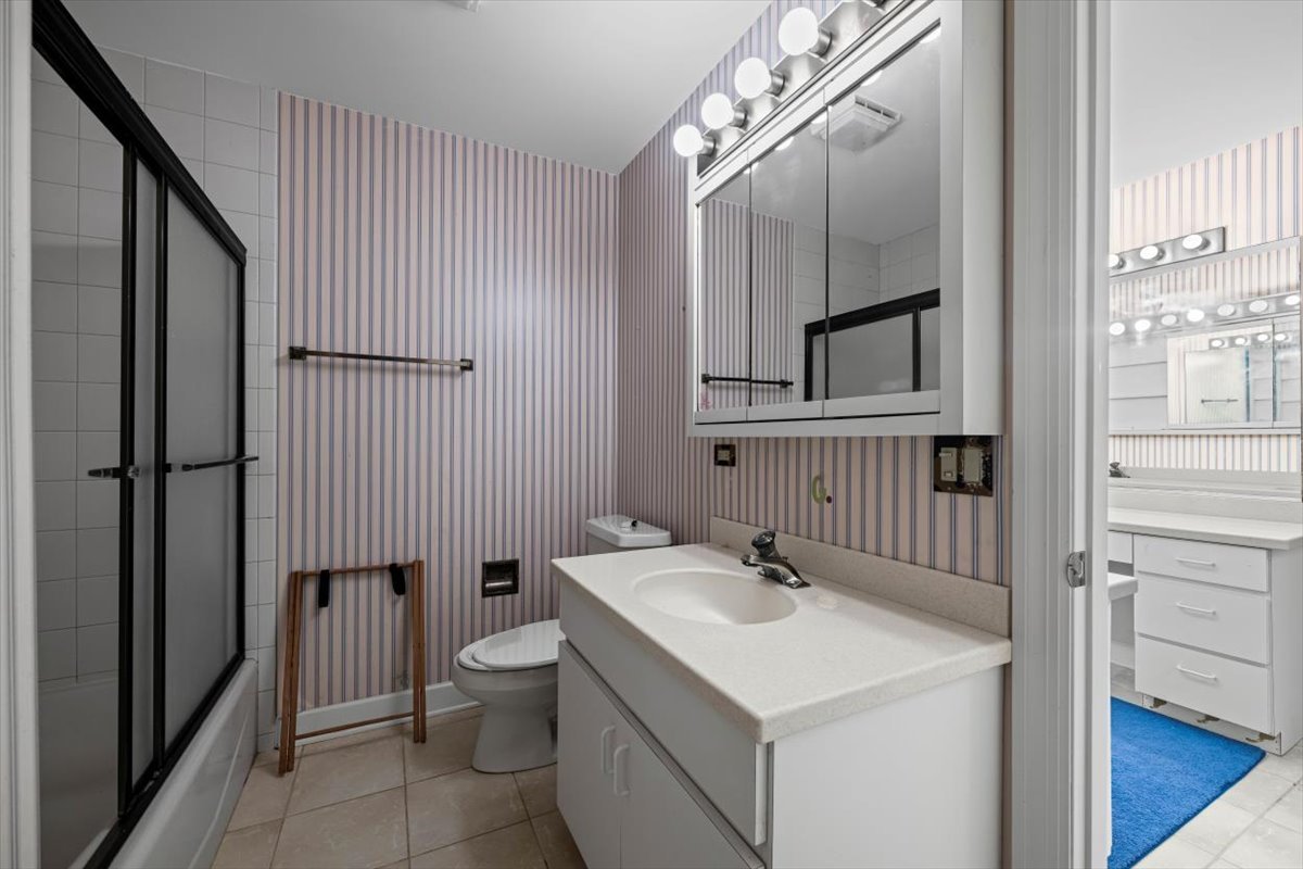 7510 East Tryon Grove Road Richmond, IL 60071 - Photo 47 of 63 a bathroom with a sink toilet and shower