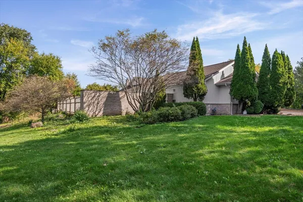 a backyard of a house with lots of green space