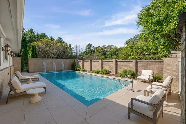 a view of a backyard with wooden fence