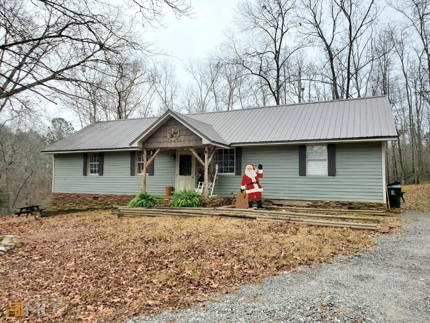 a front view of a house with yard