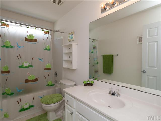 8433 Aztec Dawn Court Raleigh, NC 27613 - Photo 18 of 23 Large upstairs hall bath with cultured marble counters and white vanity with brushed nickel hardware!