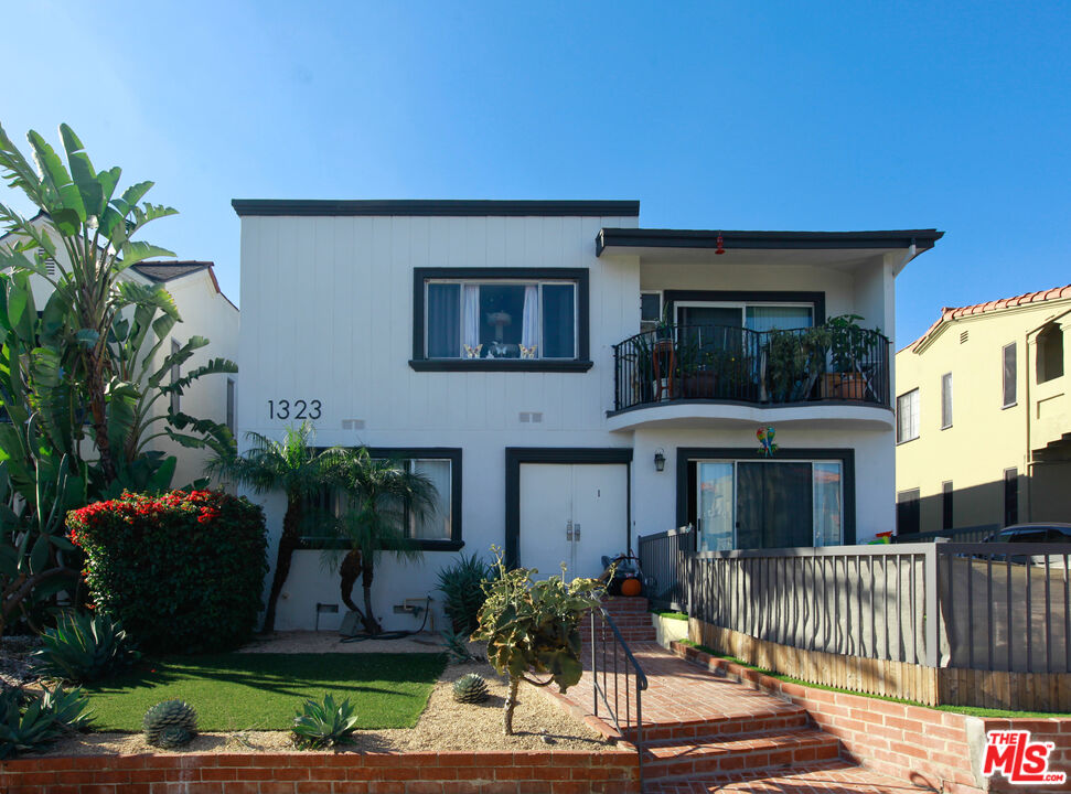 1323 South Ridgeley Drive, Unit 2 Los Angeles, CA 90019 - Photo 11 of 11 a front view of a house with yard