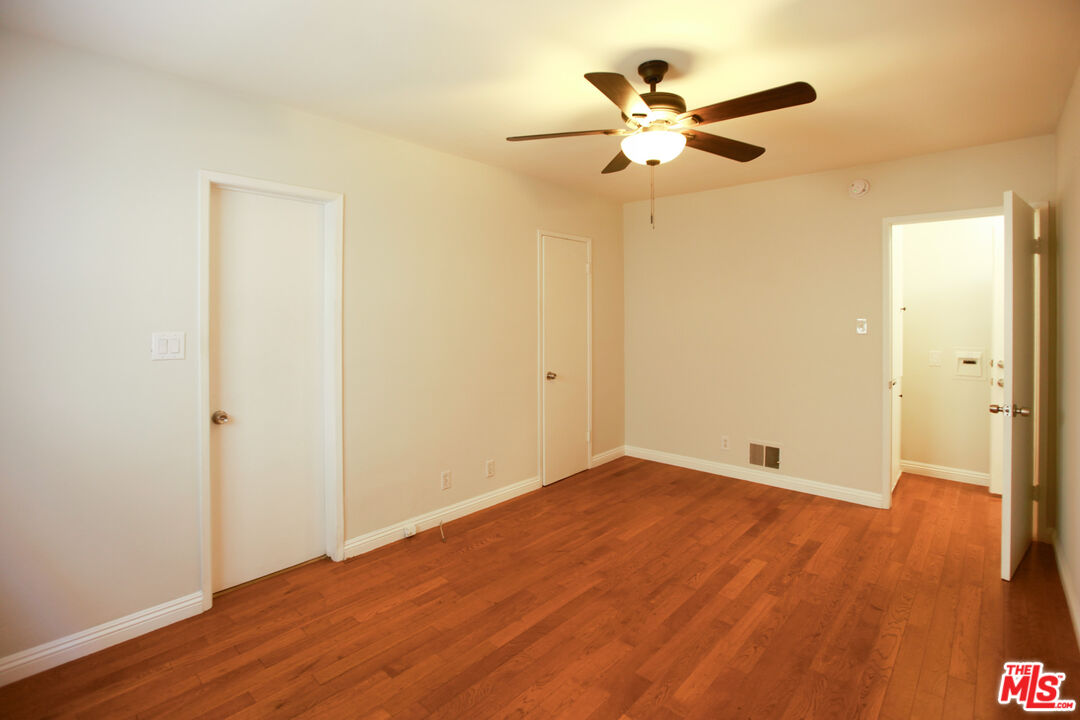1323 South Ridgeley Drive, Unit 2 Los Angeles, CA 90019 - Photo 4 of 11 a view of an empty room with wooden floor