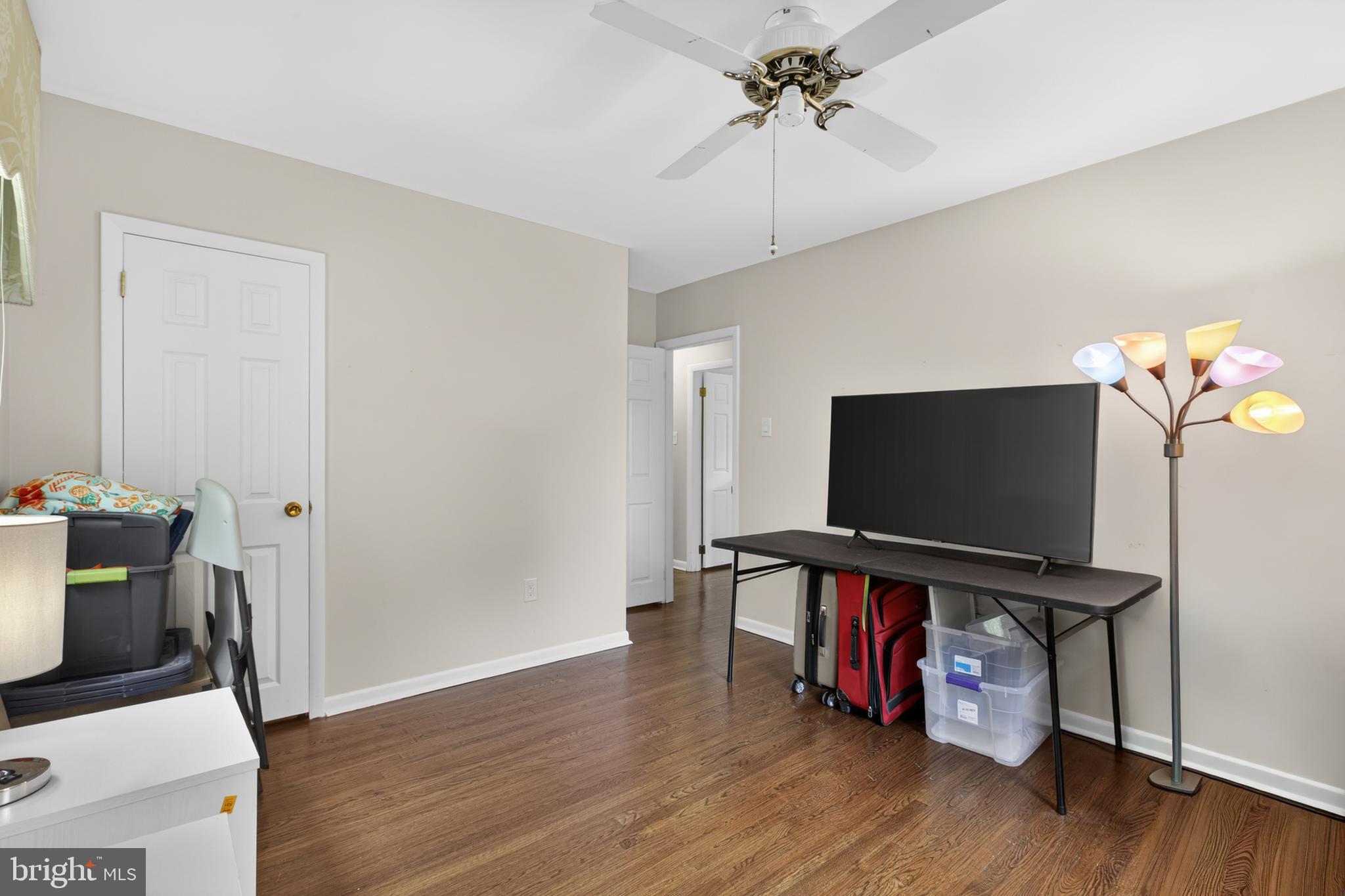 216 Revere Road Marlton, NJ 08053 - Photo 23 of 47 a living room with wooden floor and flat screen tv