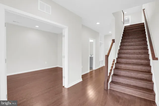 a view of entryway with wooden floor