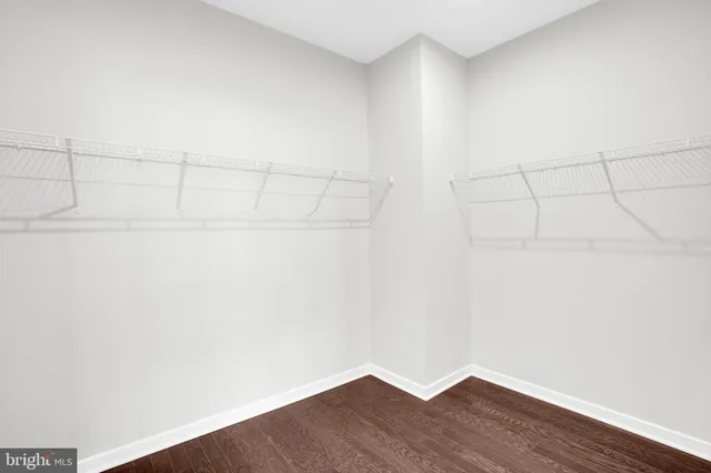 a view of a small space with wooden floor