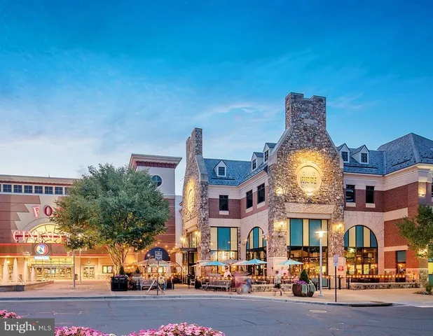 a city street lined with buildings and a street