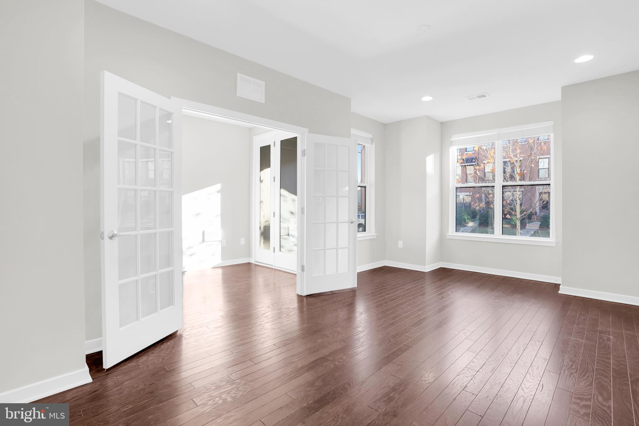 22954 Sullivans Cove Square Brambleton, VA 20148 - Photo 4 of 38 a view of an empty room with window and wooden floor