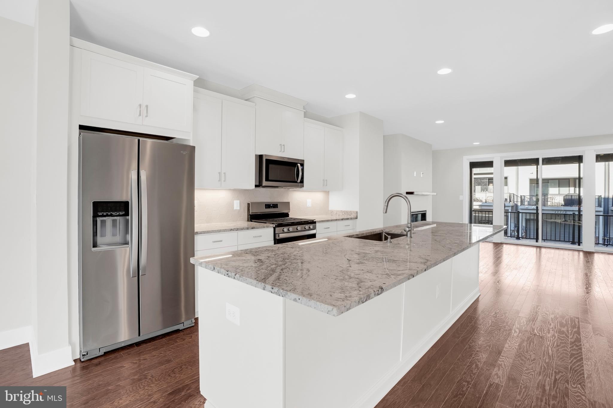 22954 Sullivans Cove Square Brambleton, VA 20148 - Photo 10 of 38 a kitchen with counter top space cabinets and stainless steel appliances