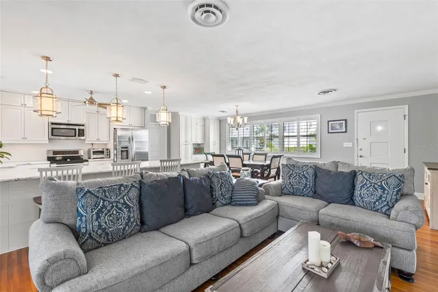 a view of living room kitchen with furniture and fireplace