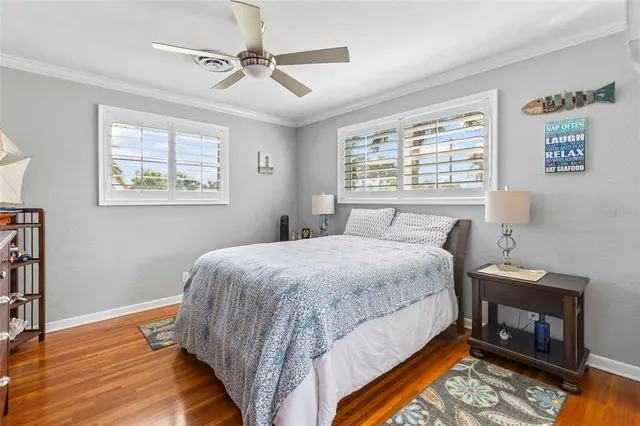 a bedroom with a large bed and a dresser