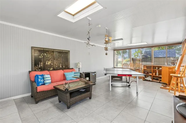 a room with gym equipment and large windows