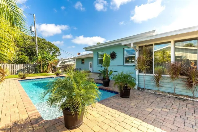 a patio with table and chairs