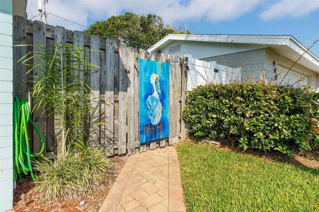 an aerial view of a houses with a swimming pool
