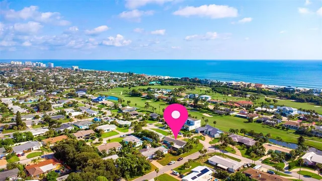 a house with swimming pool in front of it