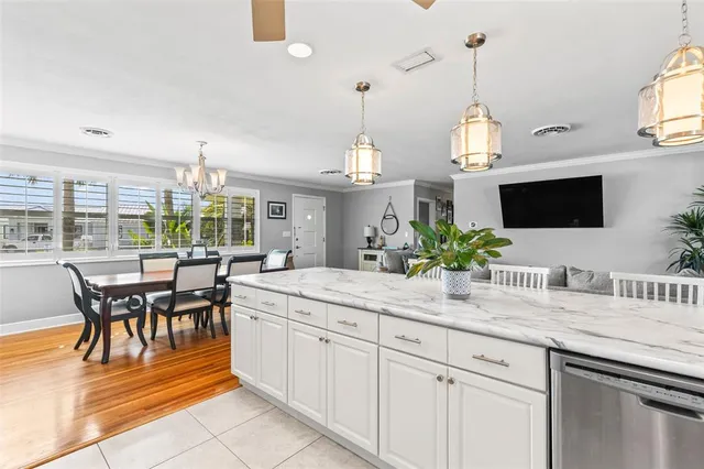 a kitchen with sink and cabinets