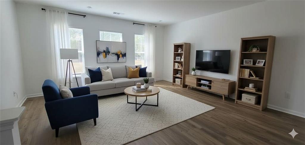 93 Wilder Ridge Way Lawrenceville, GA 30044 - Photo 2 of 8 a living room with furniture and a flat screen tv