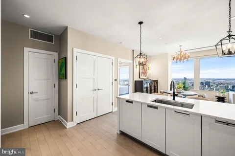 a room with a sink double vanity and a mirror