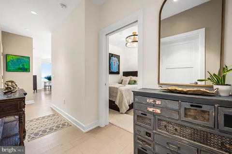 a spacious bathroom with a granite countertop sink and a mirror