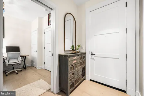 a bedroom with a bed and a chair