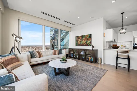 a living room with furniture and a table