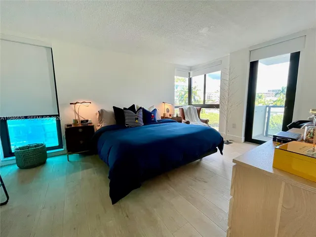 a bedroom with bed and window