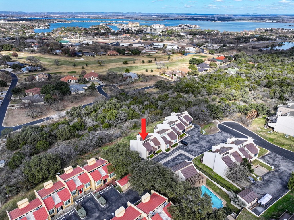 409 Hi There, Unit M Horseshoe Bay, TX 78657 - Photo 32 of 33 Aerial view of property and surrounding area featuring nearby suburban area and a nearby body of water