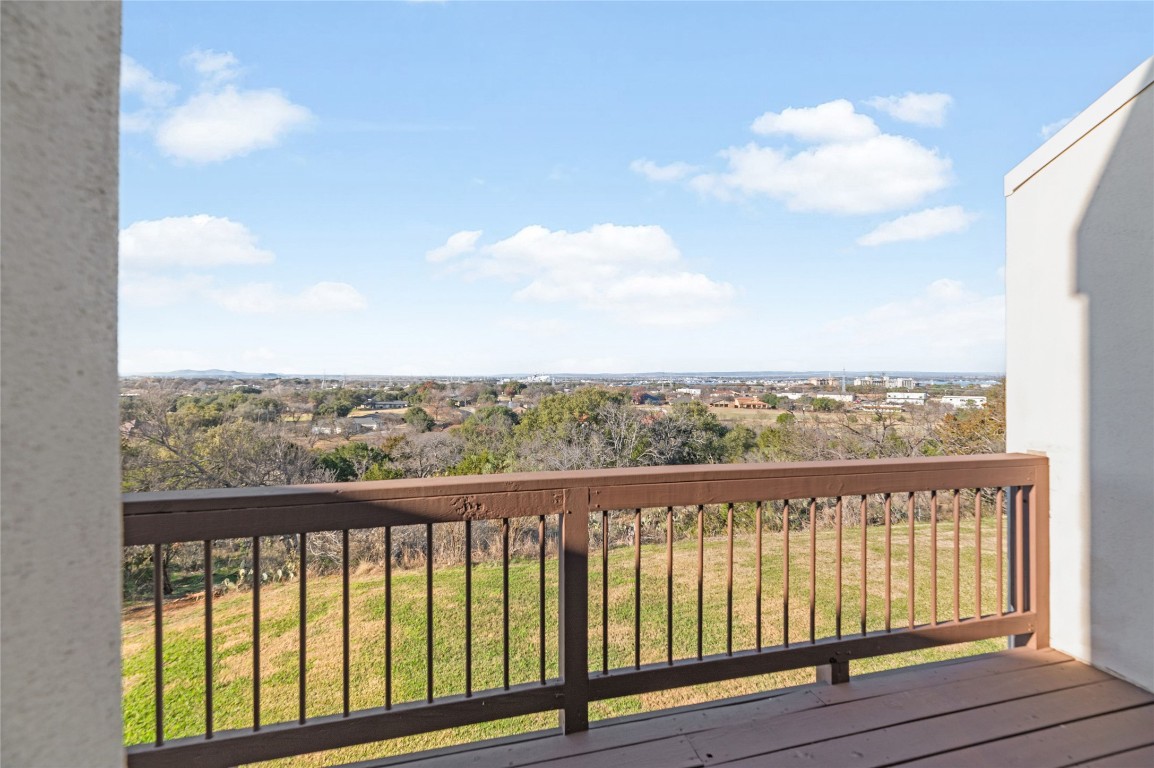 409 Hi There, Unit M Horseshoe Bay, TX 78657 - Photo 10 of 33 Wooden terrace featuring a yard