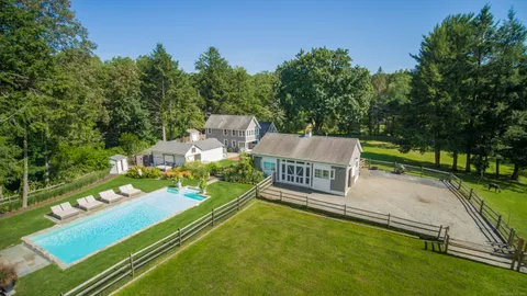 an aerial view of a house with a garden and deck