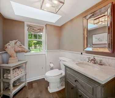 a spacious bedroom with a bed and glass door