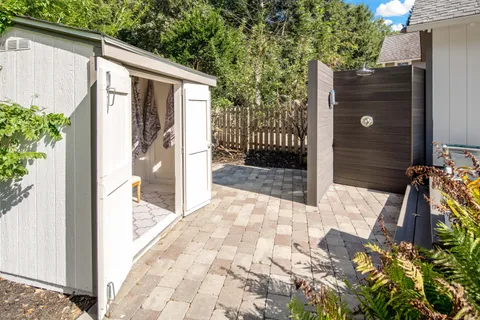 a view of a house with swimming pool and sitting area