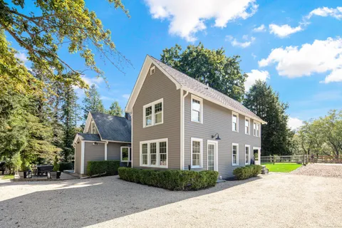 a huge green field with lots of trees