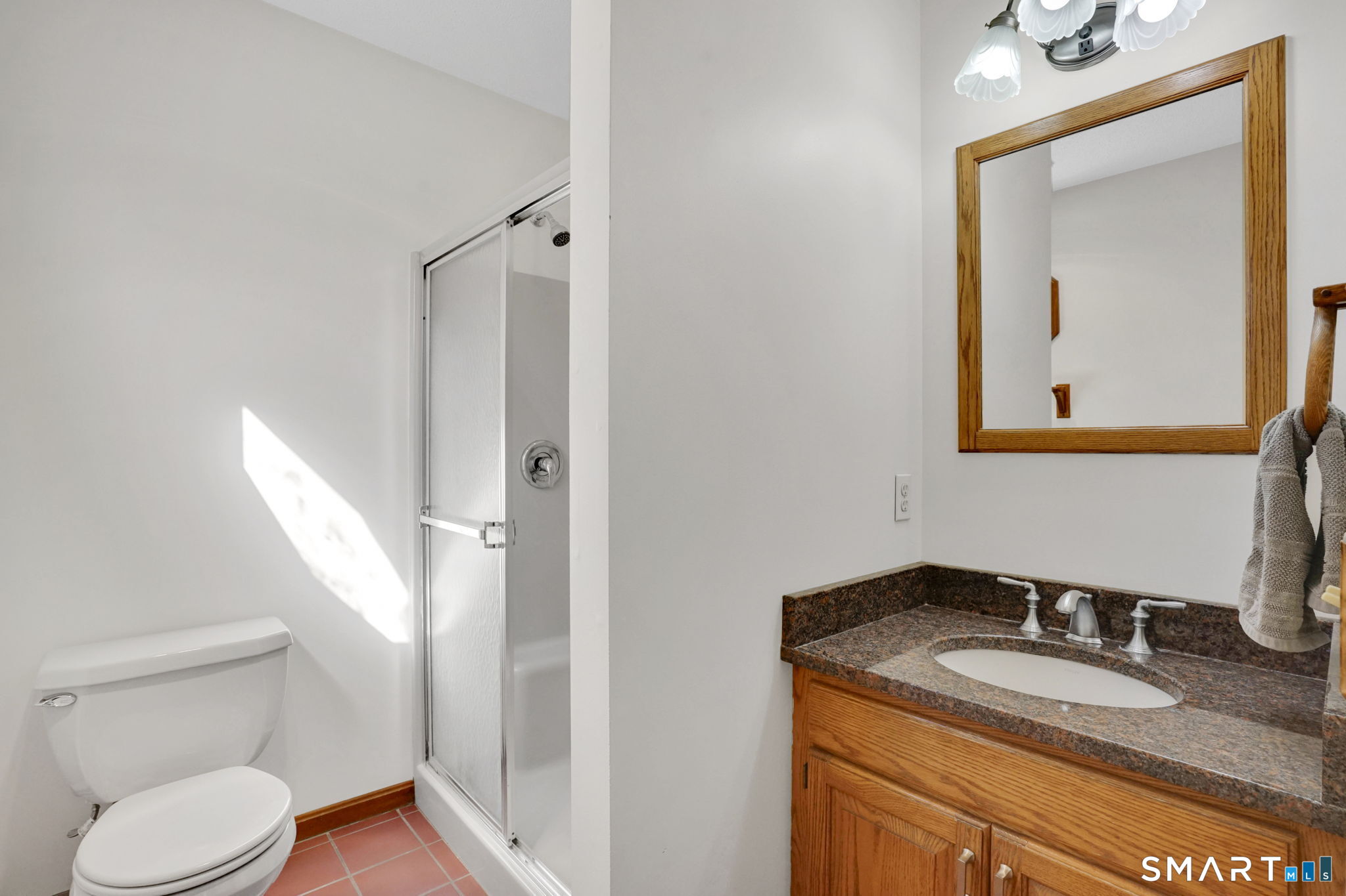 281 Turnpike Road Somers, CT 06071 - Photo 22 of 39 Primary bathroom with granite counters, shower, tile floors, linen closet.