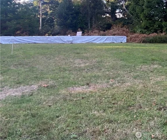 a view of outdoor space with deck and yard