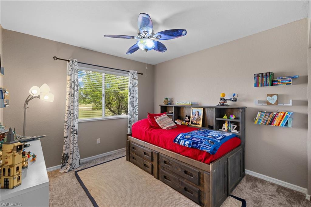 2104 Par Drive Naples, FL 34120 - Photo 23 of 37 a bed room with a bed and a baby crib