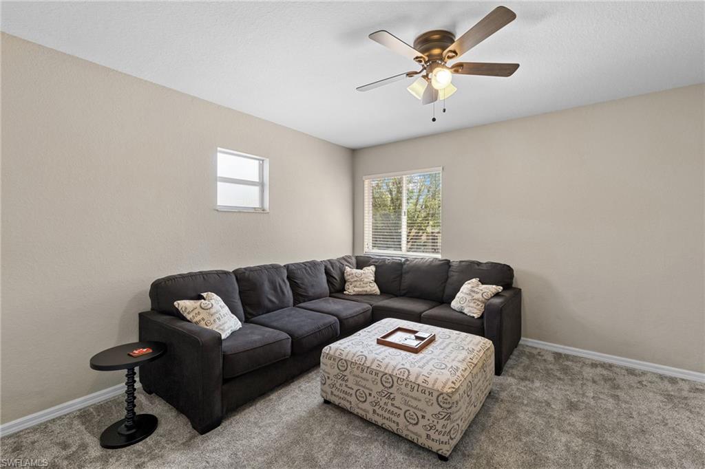 2104 Par Drive Naples, FL 34120 - Photo 24 of 37 a living room with furniture and a window