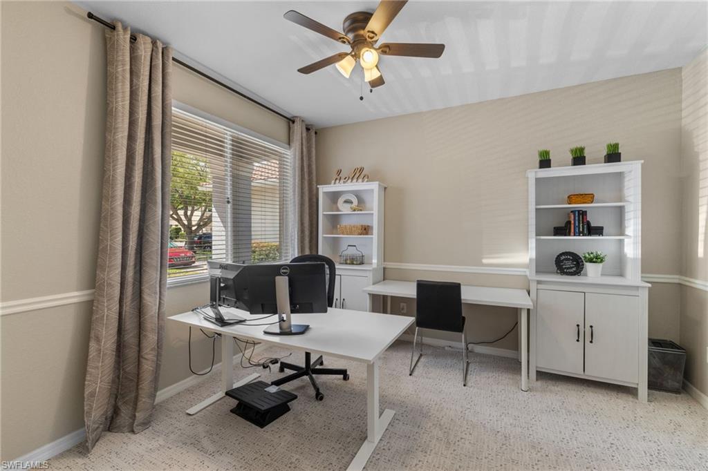 2104 Par Drive Naples, FL 34120 - Photo 25 of 37 a view of a workspace with furniture and a window