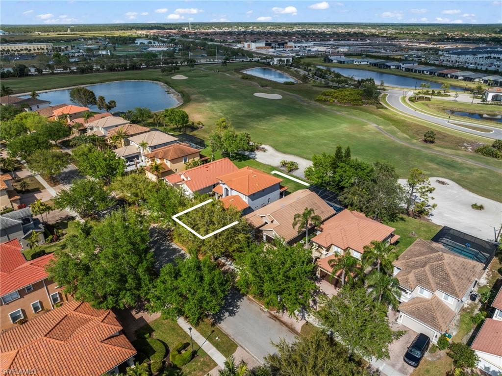 2104 Par Drive Naples, FL 34120 - Photo 32 of 37 an aerial view of a house with a lake view