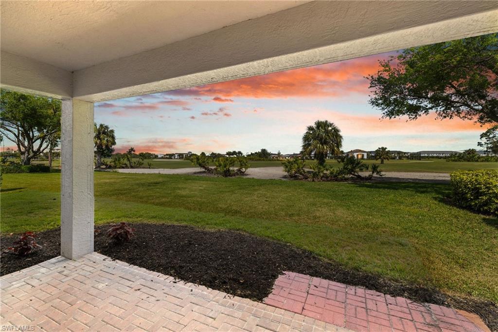 2104 Par Drive Naples, FL 34120 - Photo 37 of 37 a view of a lake with a big yard