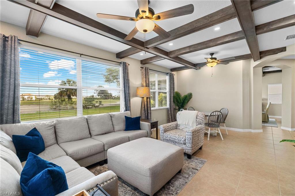 2104 Par Drive Naples, FL 34120 - Photo 4 of 37 a living room with furniture and a large window