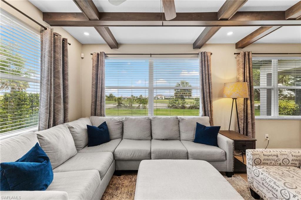 2104 Par Drive Naples, FL 34120 - Photo 5 of 37 a living room with furniture and a large window