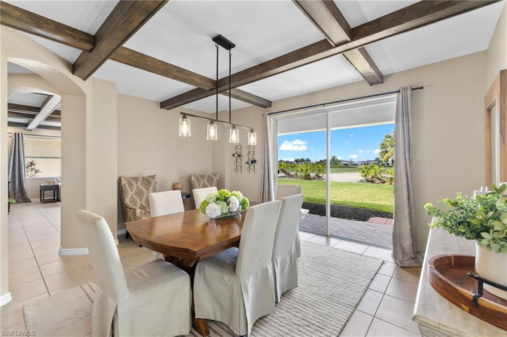 2104 Par Drive Naples, FL 34120 - Photo 6 of 37 a outdoor dining space with furniture and a potted plant