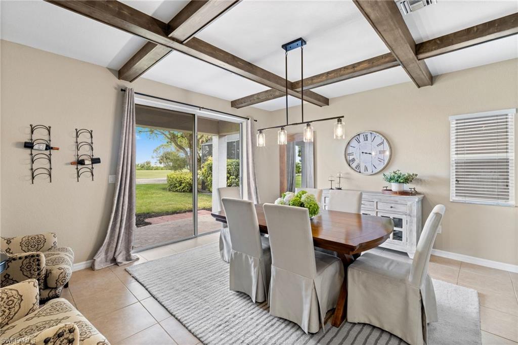 2104 Par Drive Naples, FL 34120 - Photo 9 of 37 a view of a dining room with furniture window and outside view