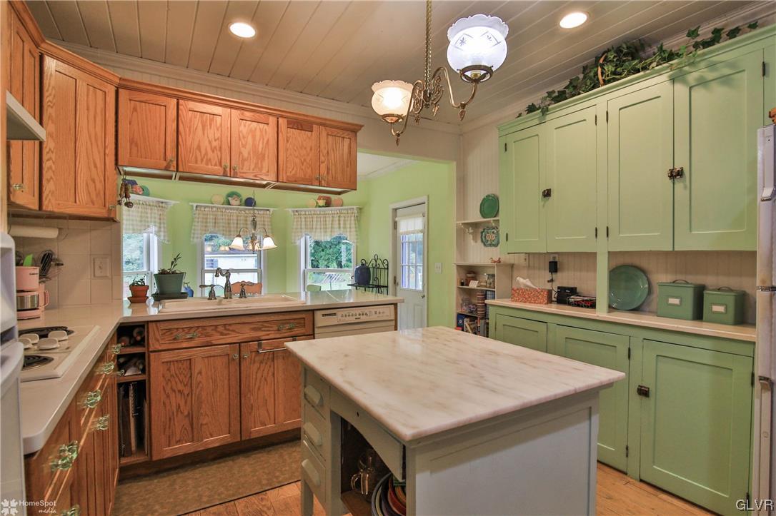 475 English Road Bath, PA 18014 - Photo 11 of 46 a kitchen with kitchen island granite countertop a sink cabinets and stainless steel appliances