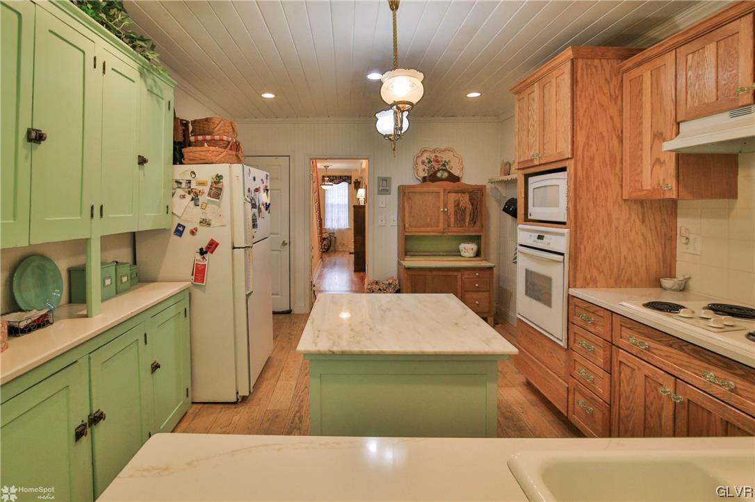 475 English Road Bath, PA 18014 - Photo 12 of 46 a kitchen with stainless steel appliances kitchen island granite countertop a refrigerator and a stove top oven