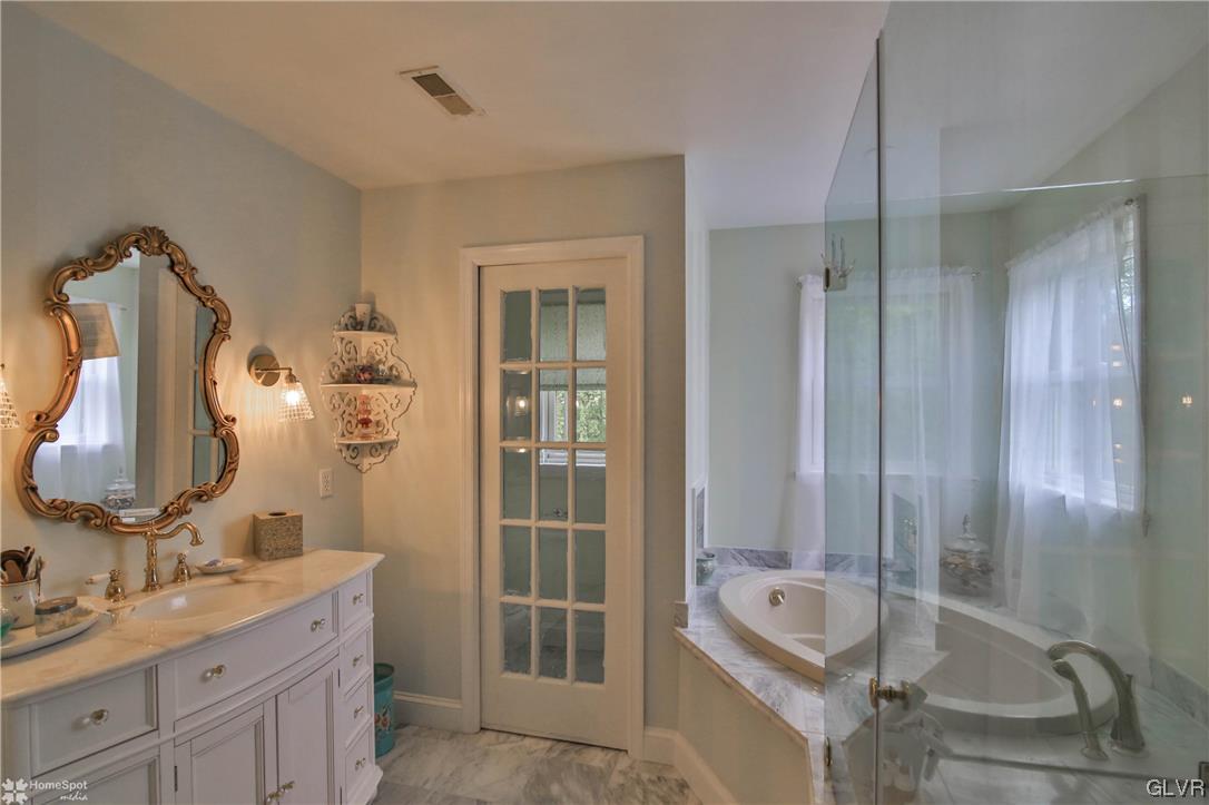 475 English Road Bath, PA 18014 - Photo 25 of 46 a bathroom with a tub sink and mirror