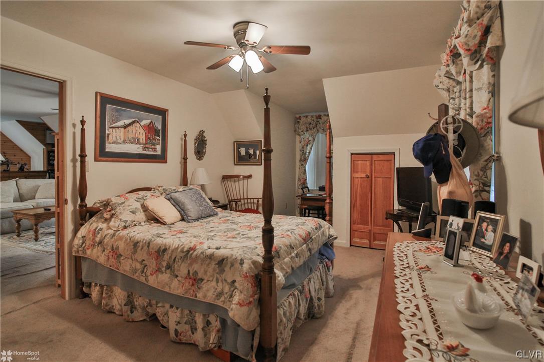 475 English Road Bath, PA 18014 - Photo 37 of 46 a bedroom with a bed a ceiling fan and a dresser