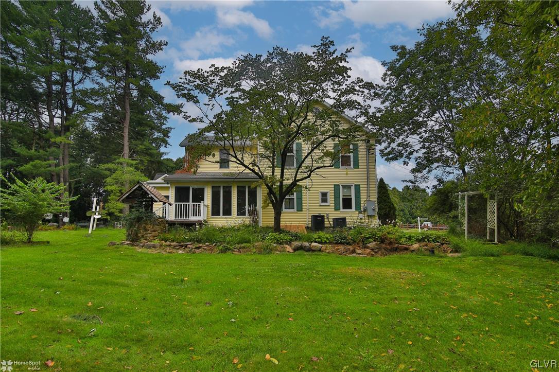 475 English Road Bath, PA 18014 - Photo 41 of 46 a front view of a house with a garden and trees