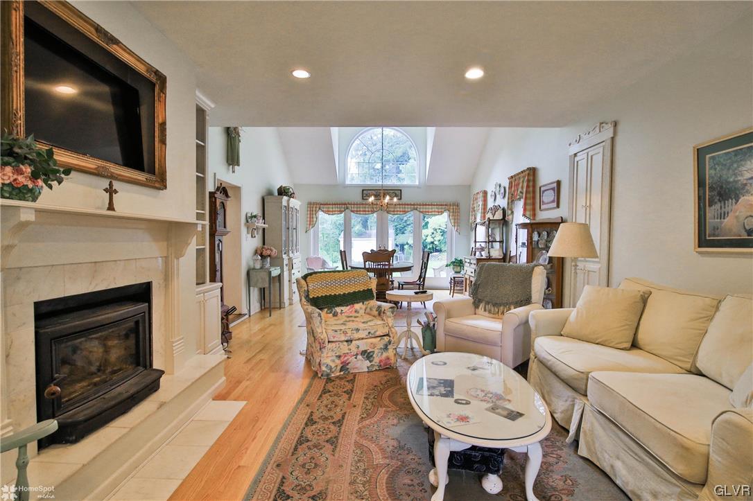 475 English Road Bath, PA 18014 - Photo 5 of 46 a living room with furniture a flat screen tv and a fireplace
