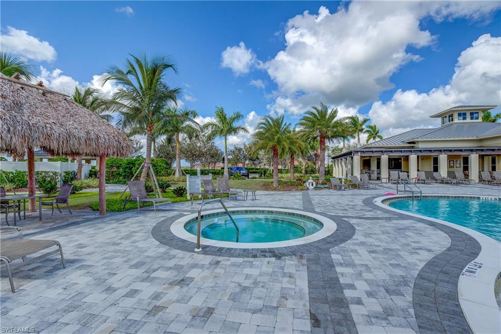2827 Blossom Way Naples, FL 34120 - Photo 20 of 31 Community pool with a patio area and a hot tub